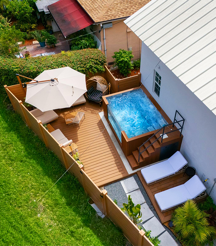 modern prefabricated swimming pool installed in residential backyard