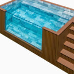 modern prefabricated swimming pool installed in residential backyard